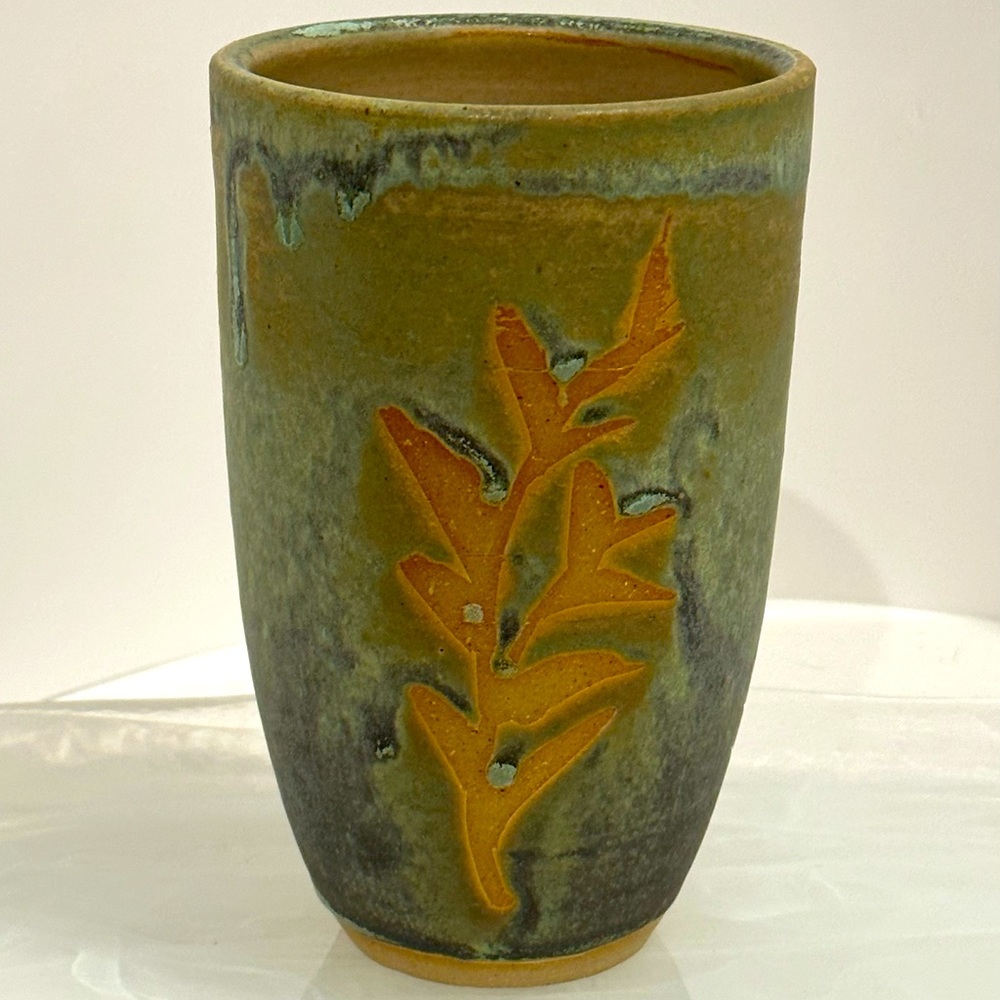 Beautiful Vase Climbing Leaves. Artist stamped his signature on the piece.